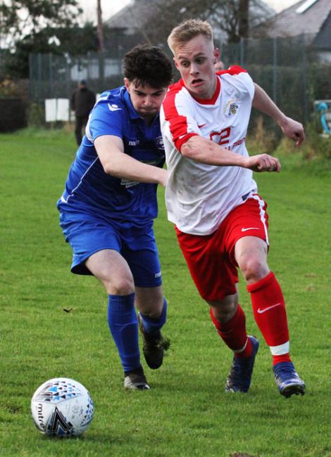 Ben Davies attacks for Merlins Bridge who thrashed Narberth. Picture by Susan McKehon.